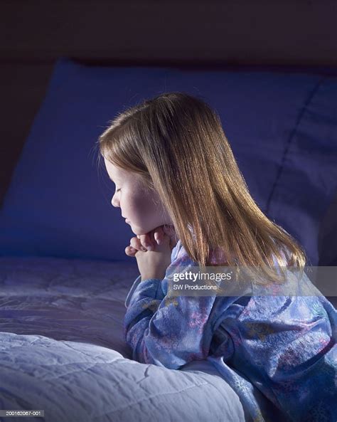 Girl Kneeling Beside Bed Praying Side View High Res Stock Photo Getty