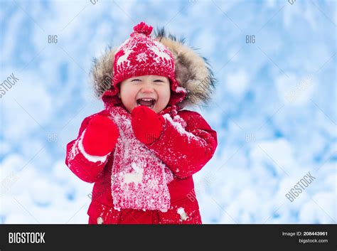 Baby Playing Snow Image And Photo Free Trial Bigstock