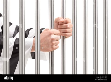 Male Hands Holding Prison Bars Stock Photo Alamy