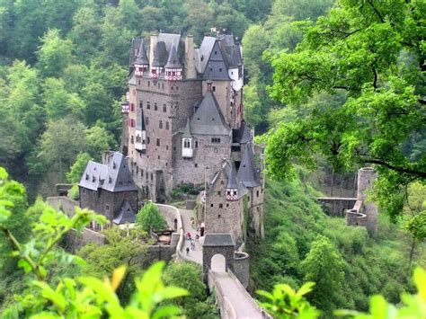 Burg Eltz Is Surrounded By Elzbach River Tributary And Is Nestled On A