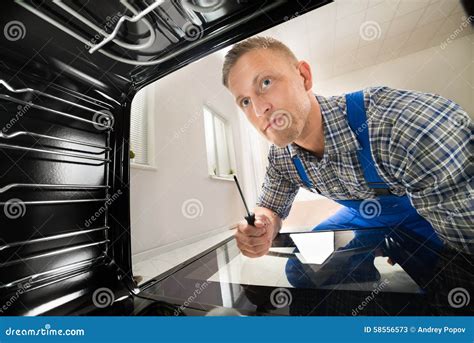 Repairman Fixing Kitchen Oven Stock Image Image Of Repair Person