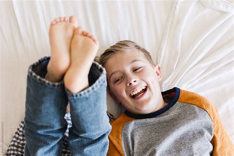 Brothers Laughing And Playing On A Bed By Kelly Knox
