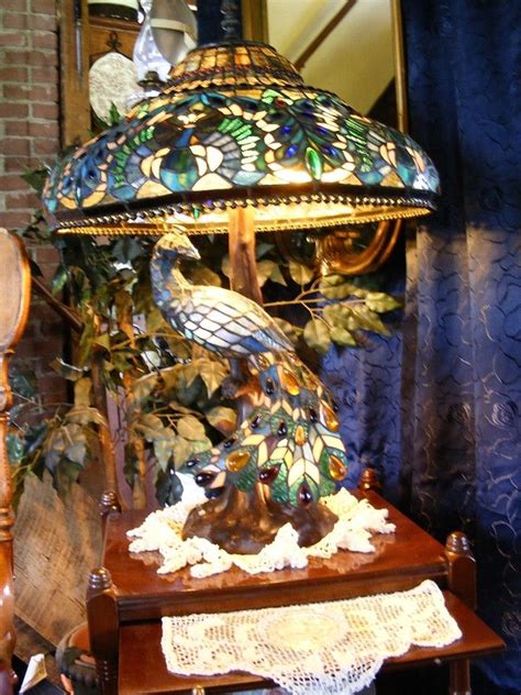 Consider a stained glass hanging with peacock designs across your doorway or a fireplace mantel for some glam and let the sunlight combine with the colors for some amazing aesthetic magic. Peacock Stained Glass Lamp | Stained glass lamps, Lamp ...