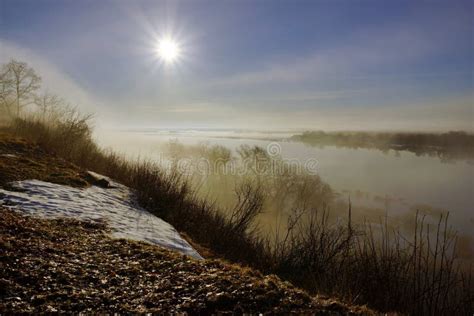 Morning Spring Fog Over The River Rises The Sun Is Melting Snow Stock