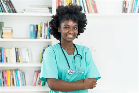 African American Medical Student Or Young Nurse At Work Stock Photo