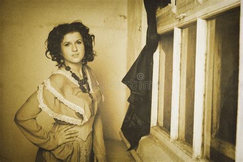 Photo Of Curly Brunette In Retro Style With Sepia Effect Stock Image