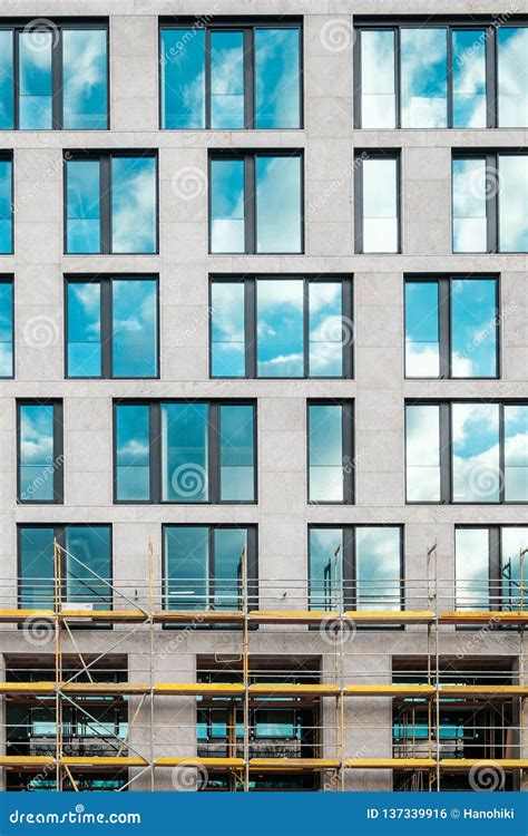 Modern Office Building Facade Front Partly With Scaffolding Stock