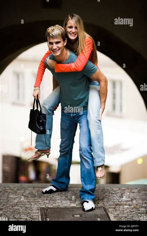 Man Carrying Woman Stock Photo Alamy