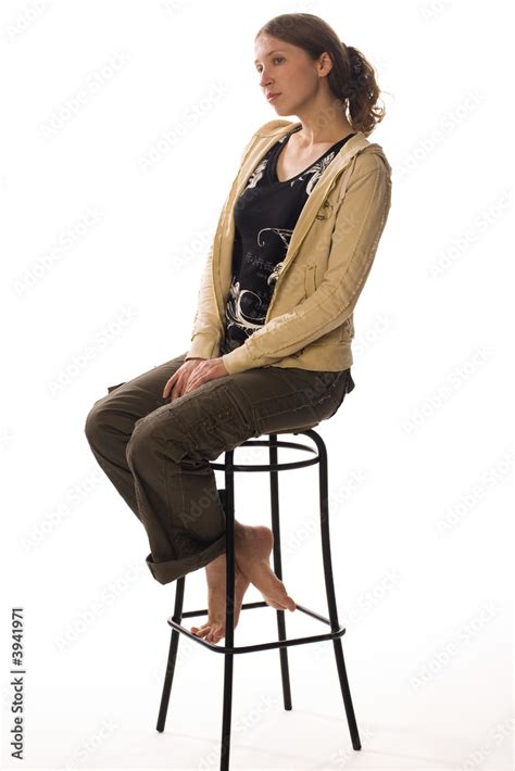 Sad Girl Sitting On A Stool Stock Photo Adobe Stock