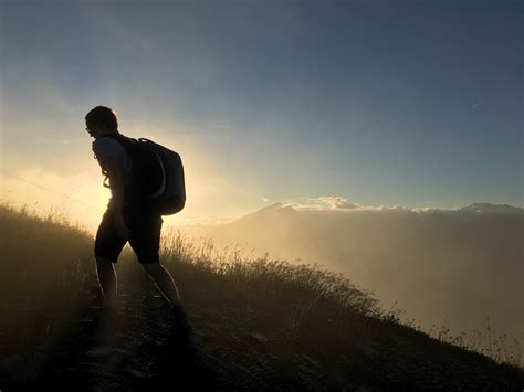 Free Images Man Sea Grass Horizon Silhouette Mountain Cloud