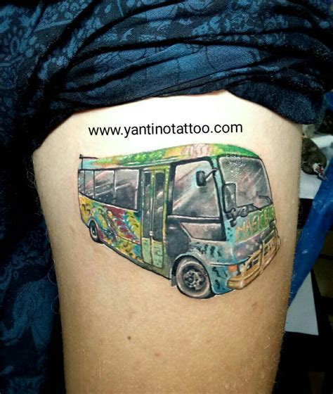 a colorful bus tattoo on the thigh