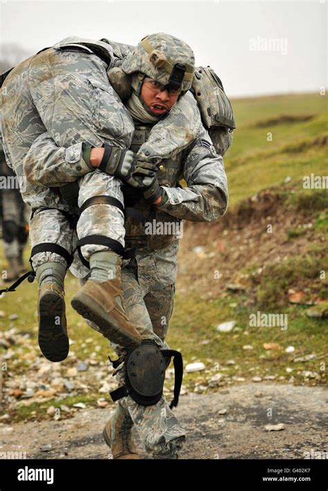 A Soldier Transports A Fellow Wounded Soldier Using The Firemanâ€ S
