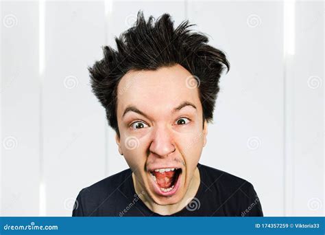 Sad Anger Young Guy Look In Camera And Cry With Open Mouth And Scream