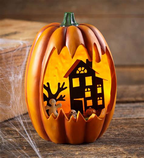 Lighted Faux Carved Pumpkin With Haunted House Plowhearth