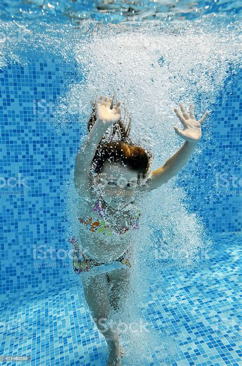 Underwater Child Jumps To Swimming Pool Stock Photo Download Image