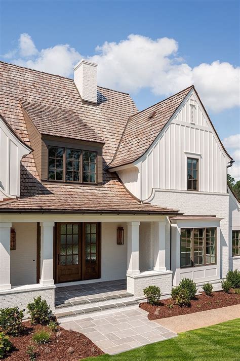 Modern Farmhouse Exterior With Classic Elements Such As Painted Brick