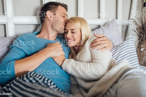 Young Couple Cuddling In Bed Stock Photo Download Image Now Adult