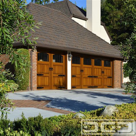A Tudor Style Home Gets A Curb Appeal Upgrade With Custom Garage Doors