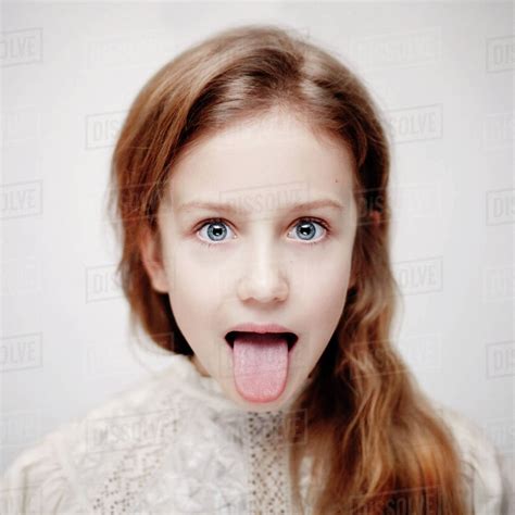 Caucasian Teenage Girl Sticking Out Tongue Stock Photo Dissolve