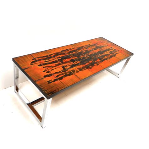 Table basse vintage en céramique orange avec piètement en métal des années 60 | Selency