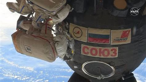 watch cosmonauts probe mysterious hole in soyuz capsule metro video