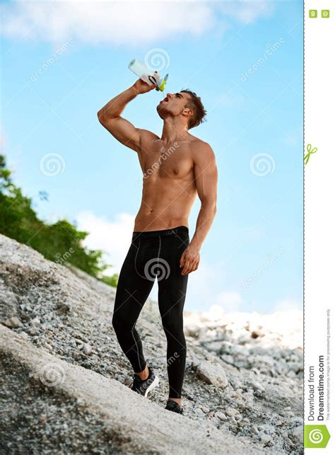 Hot Thirsty Man Drinking Water Drink After Running Outdoors Sport