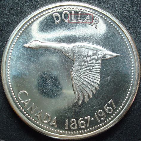 The royal canadian mint produces canada's circulation coins and collector coins: 1967 Canada Silver Dollar Coin