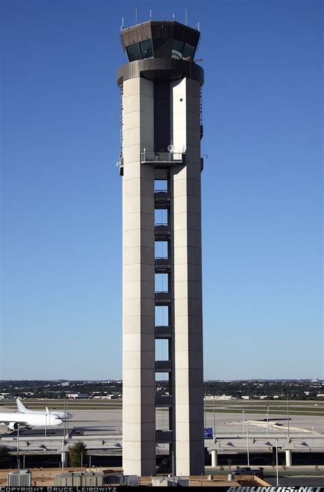 An Airport Control Tower On The Tarmac