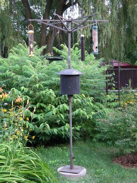 Check to see if the bird feeder pole is squirrel proof. How To Build A Bird Feeder Pole | hubpages