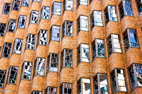Red Brick Office Building With Reflection In Windows Abstract
