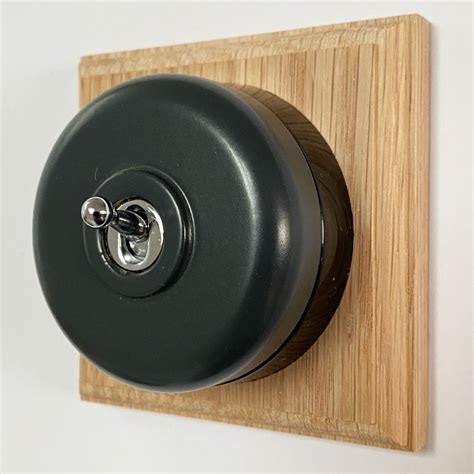 Round Dolly Light Switch 1 Gang Dark Grey Black Base Broughtons