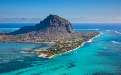 As a volcanic island country, mauritius is surrounded by coral reefs, and the island's landscape is varied. Mauritius: 16 facts to mark its 50 years of independence