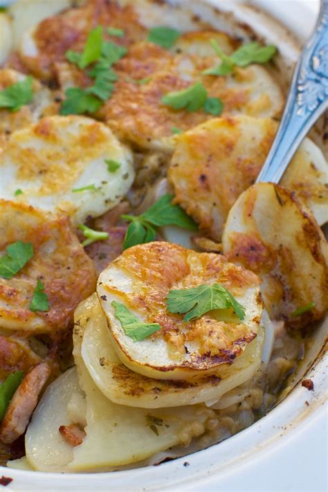 This potato bake flavoured with crispy bacon and melty brie cheese cooked in cream is an indulgent, delectable side dish you will make over and over again. Potato bake with bacon (boulangere potatoes) - Scrummy Lane