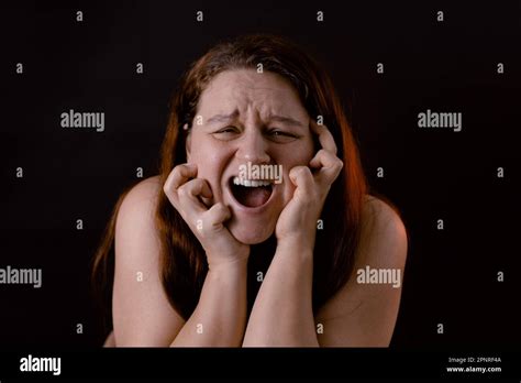 Young Crying Woman Scratching Face Shout And Scream Loud With Open