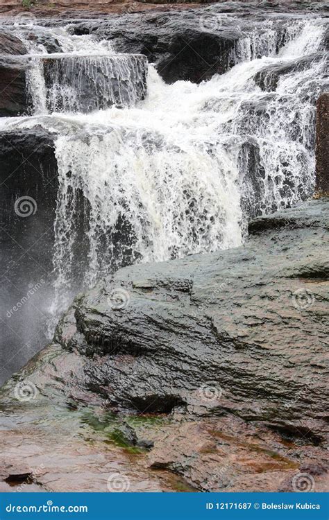 A Waterfall Flowing Into A River Stock Image Image Of Canyon