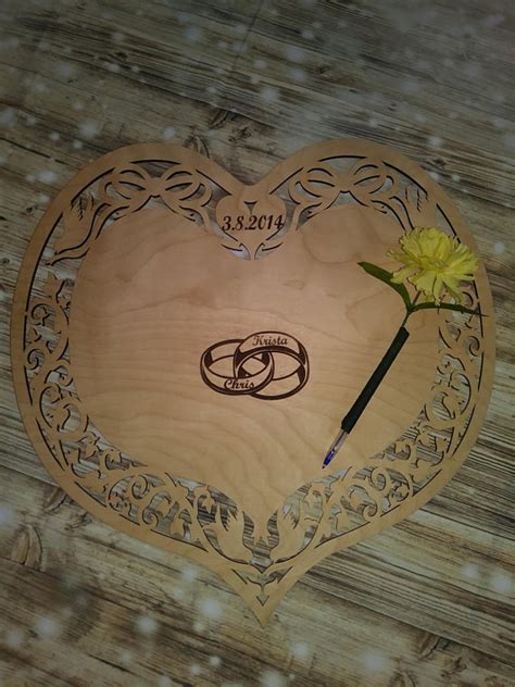 Another fun guest book alternative is to provide guests with a polaroid camera and ask them to guests can sign individual puzzle pieces that come together to create a whole. Wedding Guestbook alternative Wedding guestbook Rustic ...