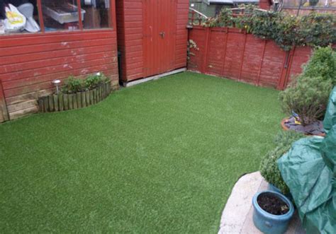Laying artificial turf on concrete pavers is a simple, yet effective way to give your yard a fresh, modern look. Outfield artificial grass installed on crazy paving in Crayford - Perfect Grass Ltd