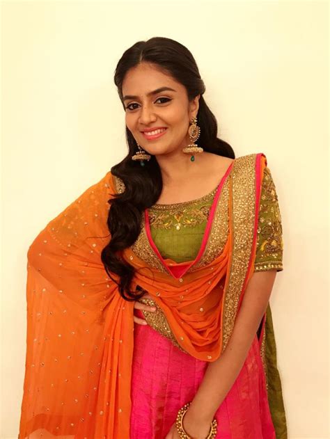 Telugu Serial Actress Sreemukhi Smiling Face Stills In Orange Dress Anchor Sreemukhi