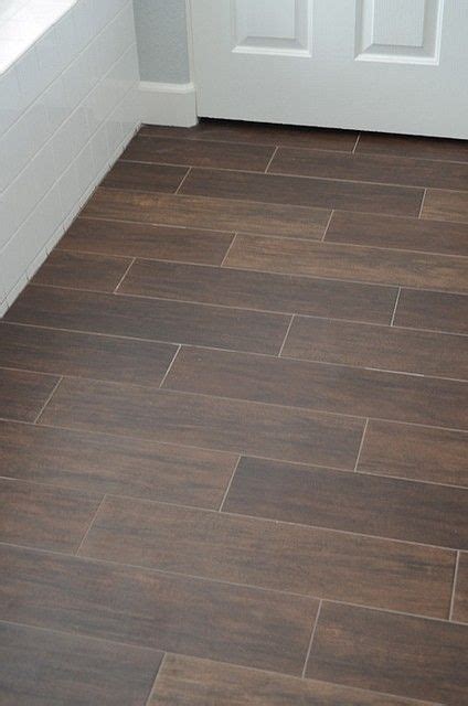 Thanks to advancements in technology and manufacturing, the level of detail that goes into creating these beautiful tiles is so precise that many of them are nearly impossible to distinguish (by the look and feel) from real wood. Ceramic tile that looks like wood, what a great idea for bathrooms and basement spaces. Love it ...