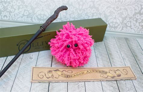 Pygmy puffs, as mentioned, are small puffskeins, so share many of the same attributes, although pygmy puffs are either pink or purple, rather than the custard colored fluff of the puffskein. Make a Pygmy Puff: Harry Potter Craft Project - Morena's ...