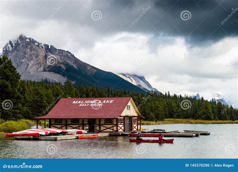 Boathouse And Canoers On Scenic Maligne Lake In Jasper National Park
