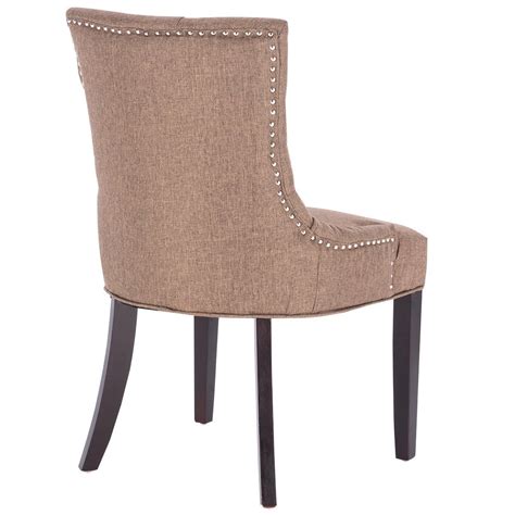 These dining chairs are sold in sets of two and require simple assembly when they arrive. Fabric Upholstered Nailed Dining Chair with Wood Legs - By ...