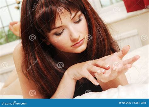 Young Woman Looking At Her Hands Stock Image Image Of Reading Brunette 9565435