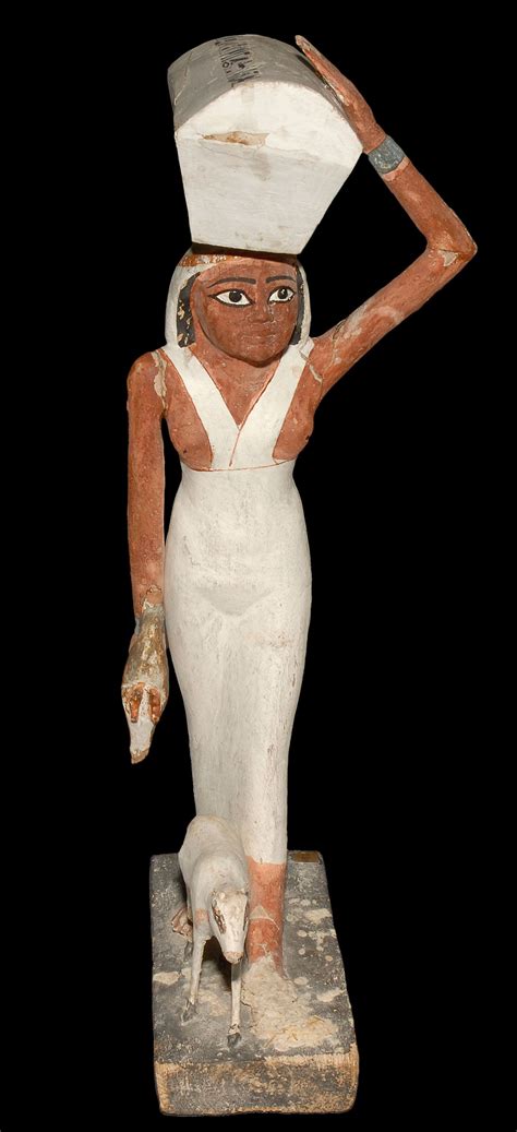 Wooden Statuette Of An Egyptian Lady Carrying A Load On Her Head Its