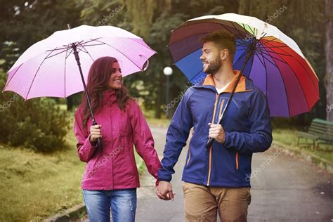 Loving Couple With Umbrella — Stock Photo © Gpointstudio 53980727