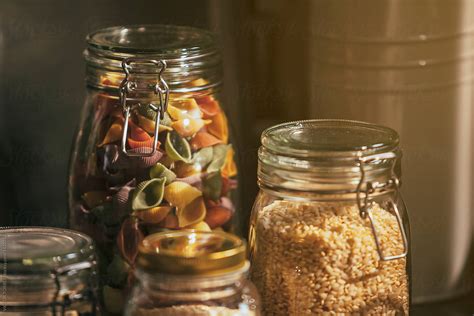 Glass Jars With Pasta And Seeds In A Rustic Kitchen Del Colaborador