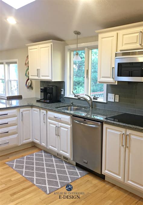 Sure, the decorations help, but it's really that crisp, clean white paint that makes the room feel brighter, bigger, and just more welcoming. Sherwin Williams White Duck painted maple cabinets and ...