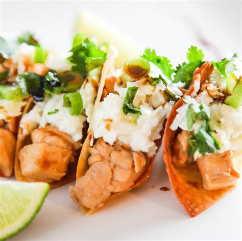 Fold the wonton wrappers into a triangle formation but do not seal. Applebee's Wonton Tacos | AllFreeCopycatRecipes.com