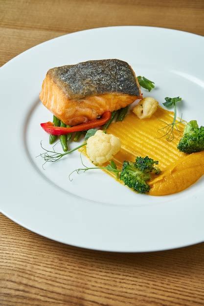 Appetizing Grilled Salmon Steak With A Side Dish Of Yellow Puree Fresh