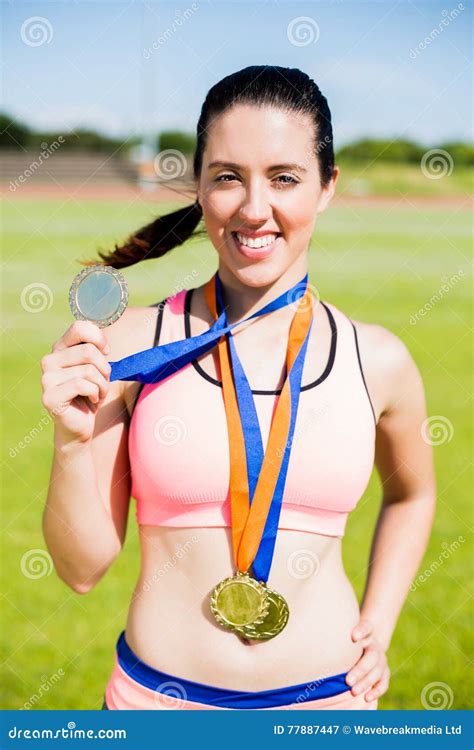 Portrait Of Female Athlete Showing Her Gold Medals Stock Image Image Of Pride Stadium 77887447